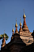 Bagan Myanmar. Next to the Gubyaukgyi stands the gilded Myazedi or 'Emerald Stupa'. 